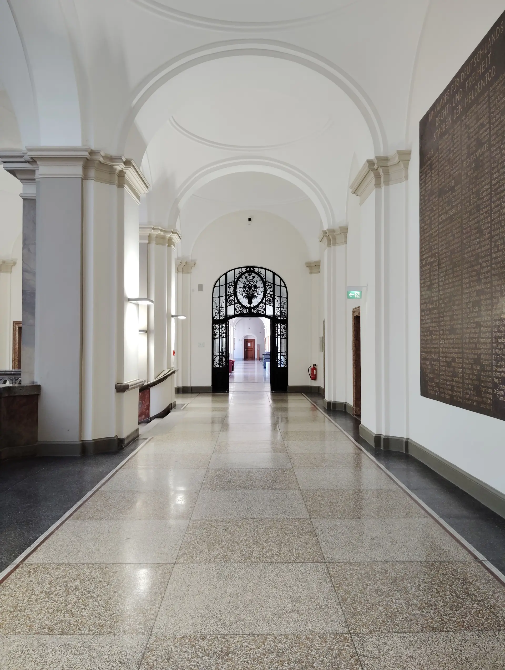 Arched stone residential interior with refined classical proportions and natural daylight