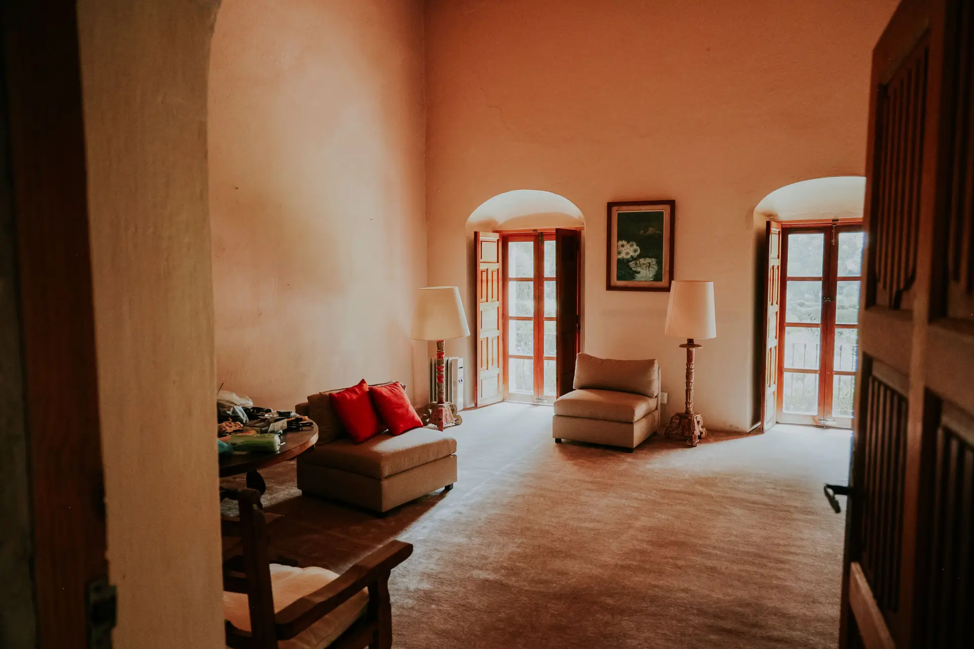 Warm living room with arched windows and natural light